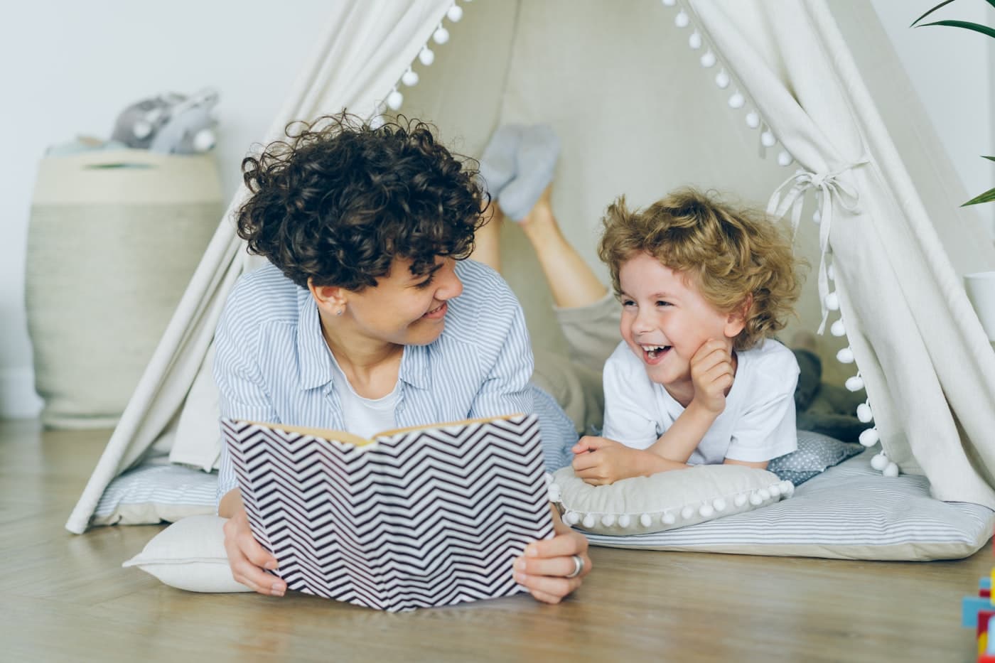 A caregiver reading a picture book with a child